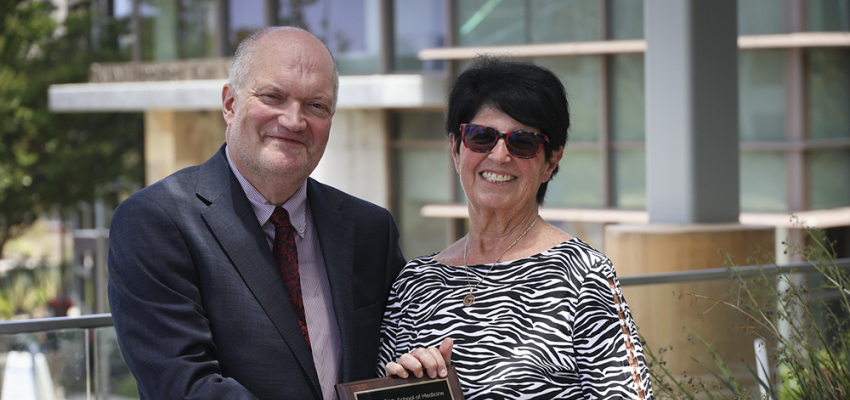 Eric Villain and Dana Mukamel at the sixth annual School of Medicine Research & Faculty Mentoring Awards