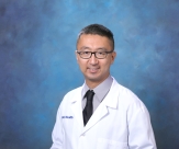 Jesse Qiao in whitecoat