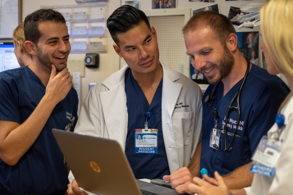 Clinical Rotation Sites - Residents training around a computer