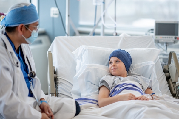 Doctor visiting a pediatric cancer patient