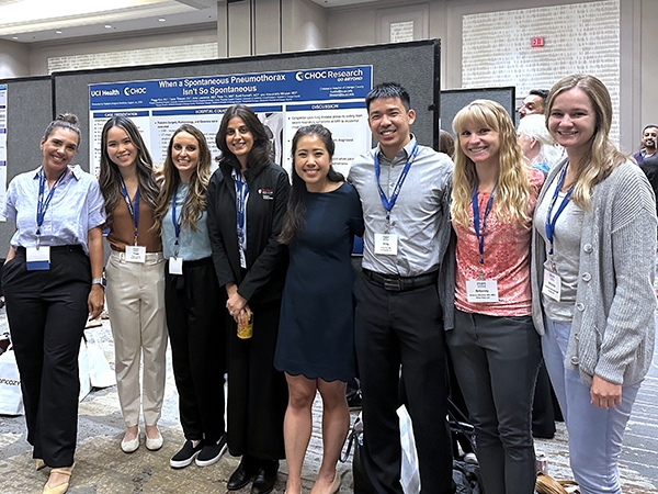 Pediatrics residents presenting research at a conference