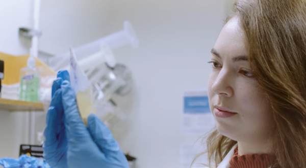 A thumbnail of PhD candidate Elizabeth Andrews taken from the "From Idea to Impact: Discovery at the Intersection of Down Syndrome & Alzheimer's Disease" video