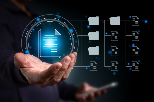 A hand holding a digital hologram of a document surrounded by networked folder icons.