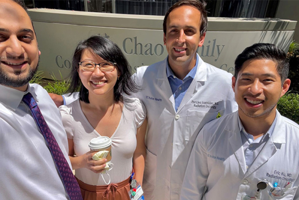Close-up of four people outside the Chao Cancer Center