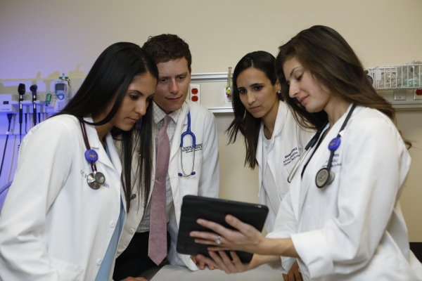 PRIME-LC graduates use an i-pad in their educational technology medical class