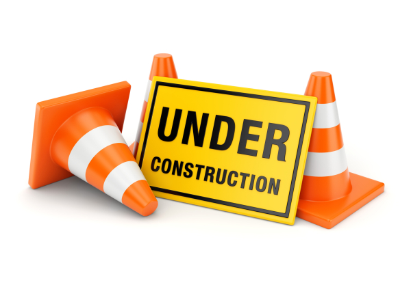 Under construction sign and traffic cones stock photo