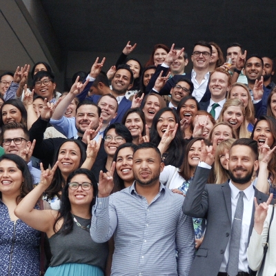A large group of medical students standing together and zotting for the camera.