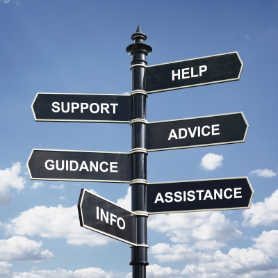 Help, support, advice, guidance, assistance and info crossroad signpost against blue sky.