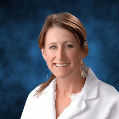 a profile headshot of Katherine McCartney in white lab coat