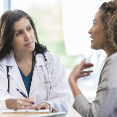 Patient discusses health with doctor
