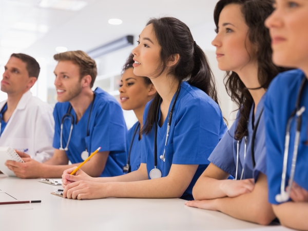 Medical students listening sitting at desk at the university