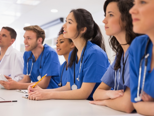 Medical students listening sitting at desk at the university