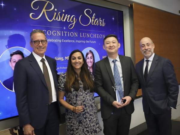 Sharma and Jiang stand holding their Rising Star awards, with Stamos and Lefteris