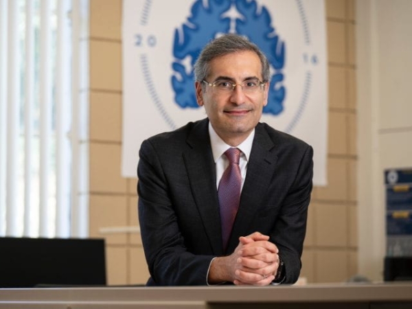 S. Ahmad Sajjadi at a desk