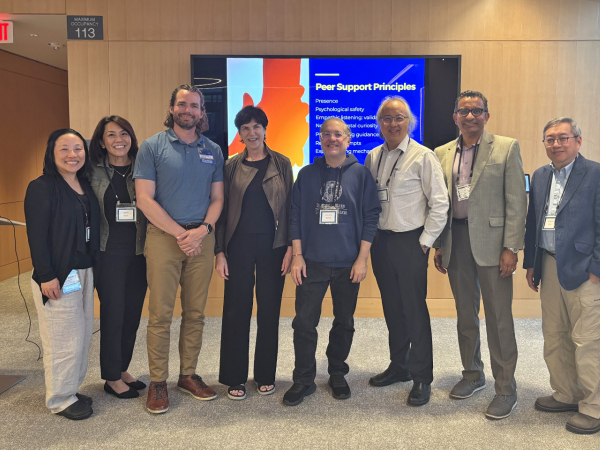 A group of eight people involved with the UC Irvine Peer Support Program