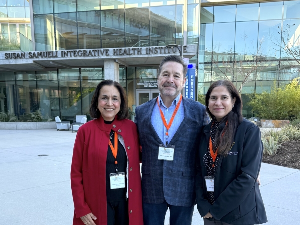 rs. Geeta Grover, Greg Buchert and Pooja Bhalla in front of the College of Health Sciences building
