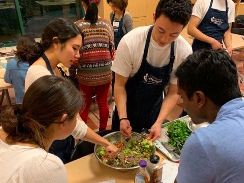 Culinary med students working on a salad