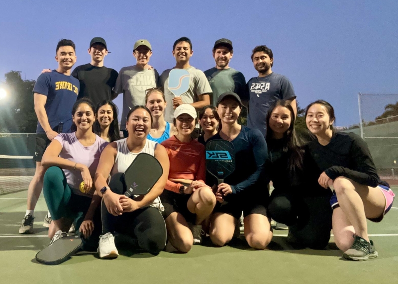 Serving up some fun and teamwork on the pickleball court with the best colleagues!