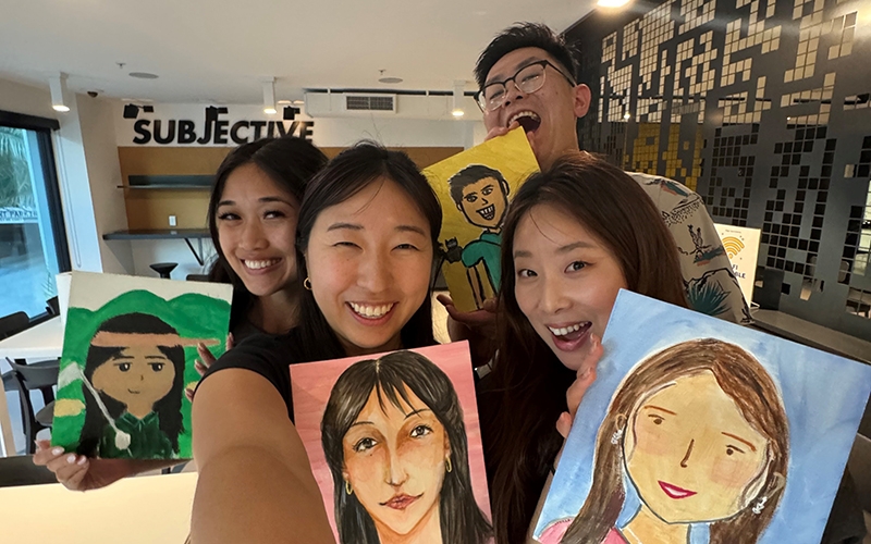 CAP fellows at a paint night event