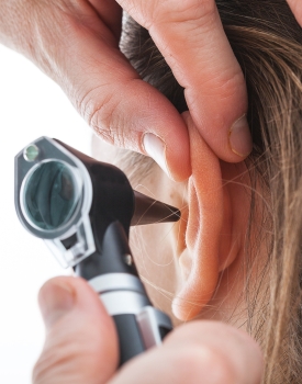 ear examination with otoscope