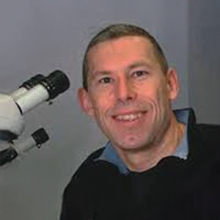 A profile headshot of Peter Verrijzer