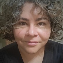 A profile headshot of Rebecca Carballar