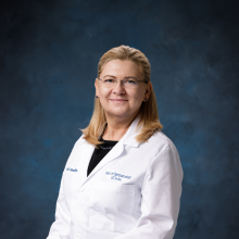 Headshot of Dorota Skowronska-Krawczyk wearing a white medical coat