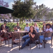 Group of people sitting together on campus