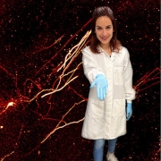 Graduate Student Alexa Tierno holds a mouse brain.