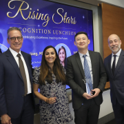 Sharma and Jiang stand holding their Rising Star awards, with Stamos and Lefteris