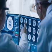 Two radiologist reviewing on screen brain scan