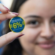 student holding UCI National Latinx Physician Day 2024 pin