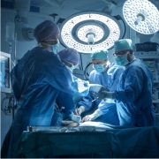 Doctors wearing blue scrubs in the operating room