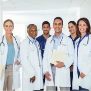 A group of male and female doctors wearing white coats