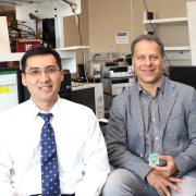 Three professors in lab space.