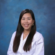 Headshot of Olivia Chang in white coat. 