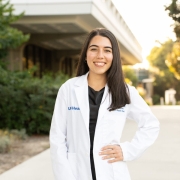 Medical student in white coat. 