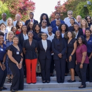 Group photo of 22 students standing with around a dozen mentors. 