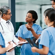 Group of medical professionals conversing.