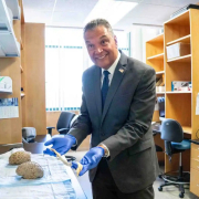 Sen. Alex Padilla holds a spinal stem while touring the MIND lab at the University of California, Irvine in Irvine, California on Sept. 8, 2026.