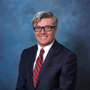 Headshot of Adrian Preda in suit. 