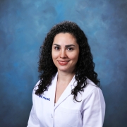 Zhina Sadeghi in white coat