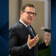 Terry Sanger speaking at microphone