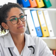 A doctor meeting with a patient in their office