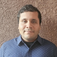 A profile headshot of Angel Zavala