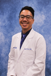 Headshot of Kevin Dao, Radiology resident, in white coat