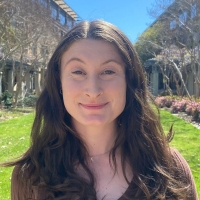 A profile headshot of Ellianna Damozonio