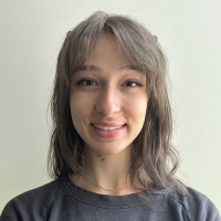 A profile headshot of Emma Monge