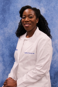 Headshot of Angellica Gordon, Radiology resident, in white coat