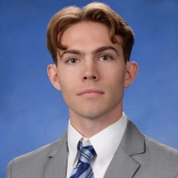 A profile headshot of James Begando